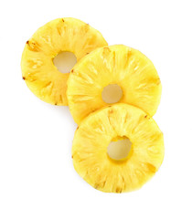 A cut slice of pineapple fruit isolated on white background