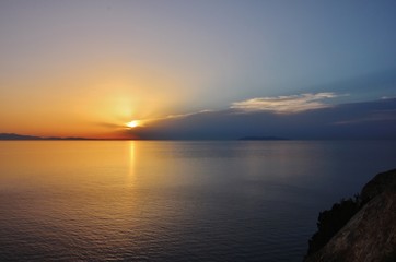 Sunset from Punta Nera, Elba island, over Corsica and Capraia islands 