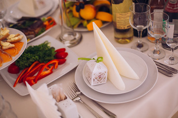 Served for a banquet catering table with wine glasses and plates for food