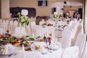 Served for a banquet catering table with wine glasses and plates for food