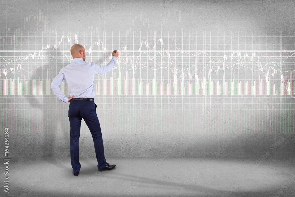 Poster man in front of a wall writing on a stock exchange interface - tradex concept