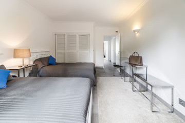 Modern apartment with white walls and light grey floor