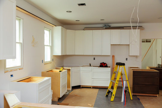 Installing new induction hob in modern kitchen