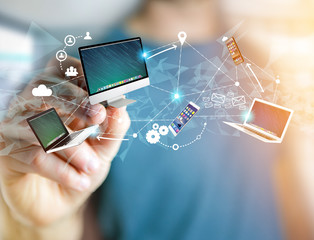 Computer and devices displayed on a futuristic interface with interantional network - Multimedia and technology concept