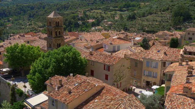 Beautiful ancient village Moustiers-Sainte-Marie in Provence, France. Panning shot