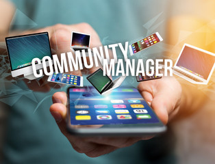 Community manager title surounded by device like smartphone, tablet or laptop - Internet and communication concept