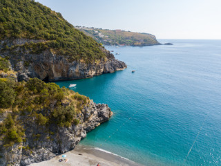 Fototapeta na wymiar Tratto di costa della Calabria, vista aerea, San Nicola Arcella, provincia di Cosenza. Spiaggia e mar Tirreno, insenature e promontori a picco sul mare. Italia