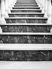 Black and white, marble stairs with banisters