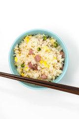 Homemade Chinese fried rice with vegetables and fried eggs
