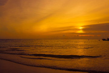 people on the beach during sunset time or silhouette