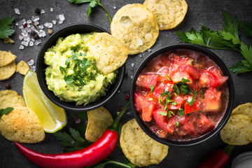 Traditional latinamerican mexican sauce guacamole and salsa on b