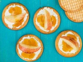 Soft Ricotta Cheese With Apple and Honey on a Biscuit or Cracker