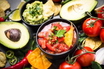 Latinamerican food party sauce guacamole, salsa, chips and ingre