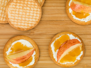 Soft Ricotta Cheese With Apple and Honey on a Biscuit or Cracker