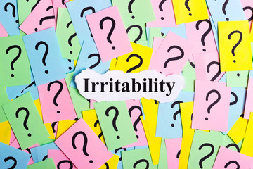 Irritability Syndrome text on colorful sticky notes Against the background of question marks