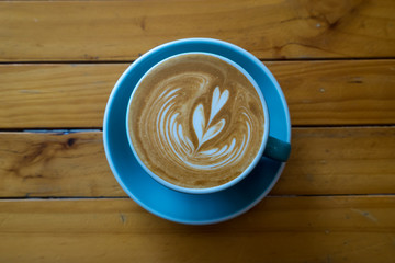 coffee latte art  on wood table