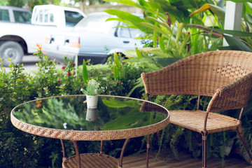 glass table and rattan wicker seat chair decoration