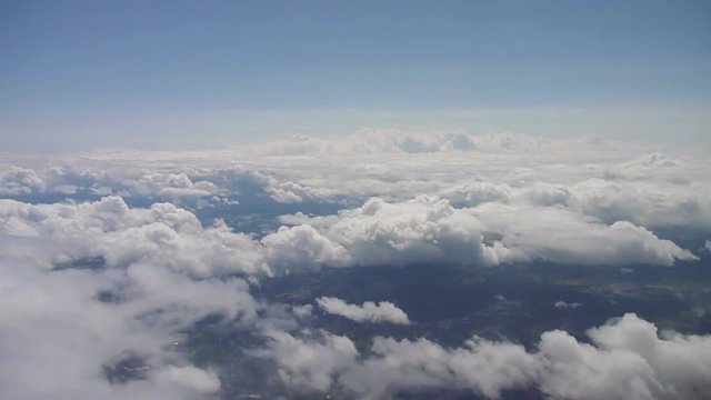 Aerial footage flying over the Pacific Northwest on partly cloudy day.