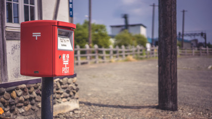 Fototapeta na wymiar Red Post Box At Hokkaido Railway Station, Japan