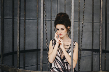 Portrait of a beautiful brunette with bright makeup on a dark background. fashion woman.