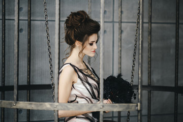 Portrait of a beautiful brunette with bright makeup on a dark background. fashion woman.