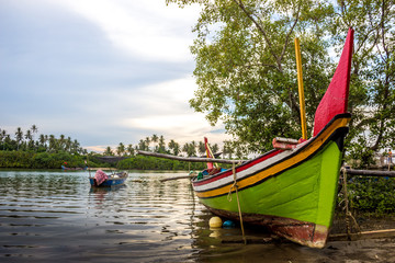 boat ships river trees village