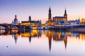 Naklejka na ściany i meble Dresden, Germany. Cathedral of the Holy Trinity or Hofkirche, Bruehl's Terrace. Twilight sunset on Elbe river in Saxony.