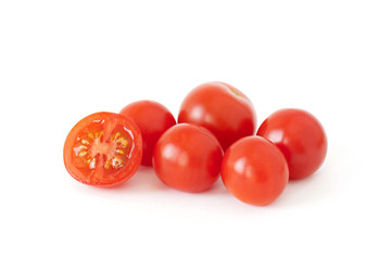 Some fresh cherry tomatoes isolated on white background