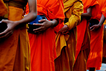 Fototapeta premium Buddhist Lent concept using : Monks in robes collecting alms picture