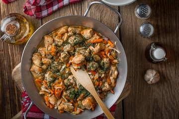 Fried chicken pieces with vegetables.