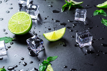Lime, mint and ice cube on a white background.