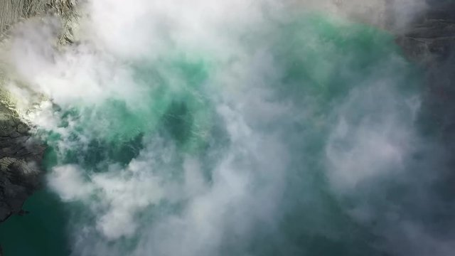 Acid Lake in the Crater of the Active Volcano Ijen