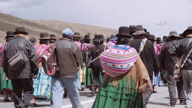 LA PAZ, BOLIVIA CIRCA FEBRUARY 2017: Men and women of the Aymara people marching to protest about the missing water in their land, wearing traditional costumes
