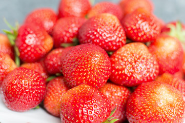 Juicy red strawberries on a plate