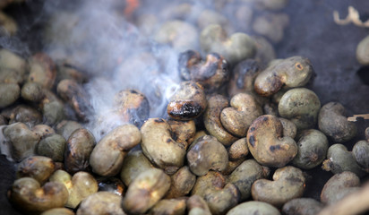 smoke and fire over roasted cashew nuts