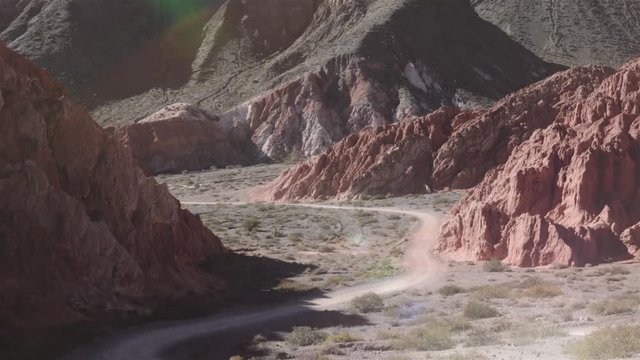 Curved road down the valley of the 7 color mountain, Purmamarca, Argentina. 4k