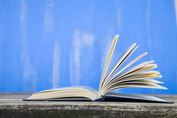 Open book on a wooden table