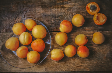 Fototapeta na wymiar Apricots on a wooden table
