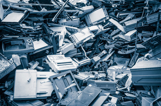 Heap of old scrap metal mainly consist of household appliance in a scrap yard