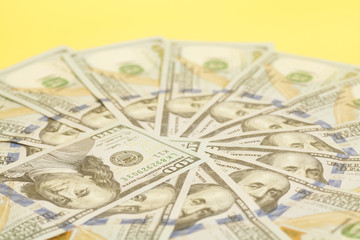 Hundred dollar US bills spread in a circle