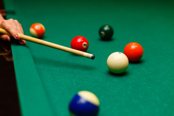 begin playing billiards, shot in white ball