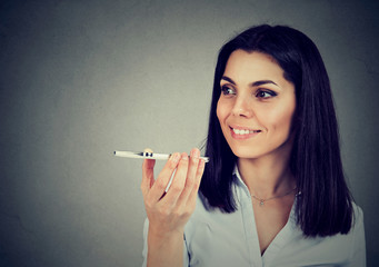 Girl using a smart phone voice recognition function online