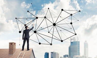 Businessman on house roof presenting networking and connection c