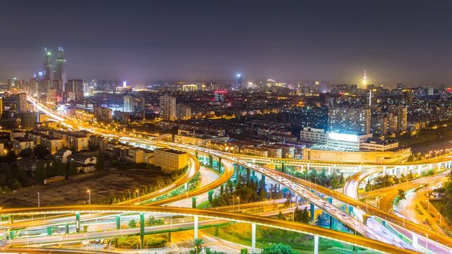Time lapse of the busy interchange traffic at night in city