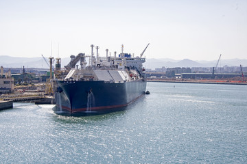 Fototapeta premium Barcelona harbor with cargo ship