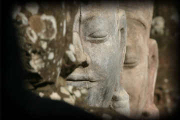 Fototapeta na wymiar Ancient Faces of Angkor Wat in Cambodia