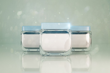 Three empty cream jars