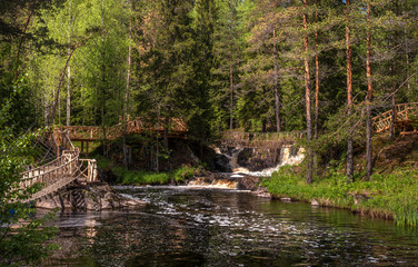 Fototapeta na wymiar Waterfall on the Tohmajoki River. Republic of Karelia, Russia, Ruskeala.