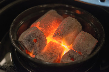 Red charcoal in barbecue grill.