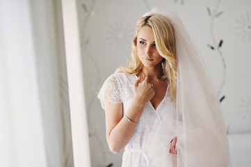 Morning of the young beautiful blonde. The fair-haired bride gathers for a wedding